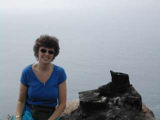 Meg at Finisterre (with the pilgrim's boot